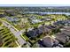 High-angle shot showcasing the community pool and recreation area, as well as nearby homes, lush landscaping, and lake views at 16003 Tangerine Blossom Way, Winter Garden, FL 34787