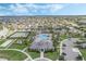 Stunning aerial view showcasing neighborhood amenities, with a beautiful community pool, and tennis courts at 16003 Tangerine Blossom Way, Winter Garden, FL 34787