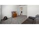 Carpeted bonus room with neutral colors and a leather couch; perfect flex space for a home office or playroom at 16003 Tangerine Blossom Way, Winter Garden, FL 34787