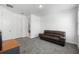 Neutral bonus room featuring gray carpet and leather couch for relaxing or entertaining at 16003 Tangerine Blossom Way, Winter Garden, FL 34787