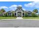 Exterior shot of the immaculate clubhouse with manicured lawn at 16003 Tangerine Blossom Way, Winter Garden, FL 34787