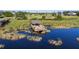 Gorgeous lake view featuring a gazebo and dock, perfect for relaxing or entertaining outdoors at 16003 Tangerine Blossom Way, Winter Garden, FL 34787
