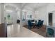Elegant foyer with tile flooring, a decorative door, leading to a dining and living area at 16003 Tangerine Blossom Way, Winter Garden, FL 34787