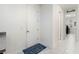 Hallway leading to the laundry room featuring new appliances and bright interior at 16003 Tangerine Blossom Way, Winter Garden, FL 34787