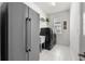 Convenient laundry room with modern washer and dryer and ample storage space at 16003 Tangerine Blossom Way, Winter Garden, FL 34787