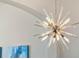 Close up of a modern chandelier with clear glass and silver metal at 16003 Tangerine Blossom Way, Winter Garden, FL 34787