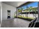 Open screened patio showcasing the brick floor, the backyard, and natural light at 16003 Tangerine Blossom Way, Winter Garden, FL 34787