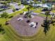 Aerial view of community picnic area with several tables, surrounded by lush landscaping and green grass at 16003 Tangerine Blossom Way, Winter Garden, FL 34787
