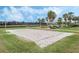 Community sand volleyball court perfect for friendly games and outdoor recreation, surrounded by green grass at 16003 Tangerine Blossom Way, Winter Garden, FL 34787