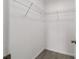 Functional closet space featuring laminate floors and wire shelving for organized storage at 177 Larch Rd, Ocala, FL 34480