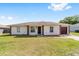 Charming single-story home with well-maintained lawn, inviting curb appeal, and a one car garage at 177 Larch Rd, Ocala, FL 34480