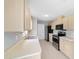 Well-lit kitchen featuring stainless steel appliances, light wood cabinets, and ample counter space at 177 Larch Rd, Ocala, FL 34480