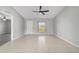 Inviting living room features neutral colors, tile floors, a window, and a modern ceiling fan at 177 Larch Rd, Ocala, FL 34480