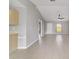 Bright, open-concept living room featuring tile floors and neutral paint scheme, great for entertaining and comfort at 177 Larch Rd, Ocala, FL 34480