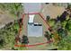 Aerial view of property, showcasing a spacious lot surrounded by lush greenery and mature trees at 18 Pine Pass Ln, Ocala, FL 34472