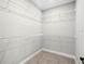 Spacious walk-in closet with ample shelving providing abundant storage space at 18 Pine Pass Ln, Ocala, FL 34472