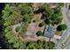 Aerial view highlights the home's proximity to the water and nature at 209 Roman Ct, Deltona, FL 32738