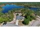 Stunning aerial view of a home near a serene lake surrounded by lush greenery at 209 Roman Ct, Deltona, FL 32738