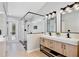 Modern bathroom with a glass enclosed shower and double vanity with contemporary finishes at 209 Roman Ct, Deltona, FL 32738