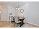 Cozy dining area with hardwood floors, an elegant chandelier, and comfortable seating for Gathering meals at 209 Roman Ct, Deltona, FL 32738