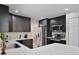 Well-equipped kitchen with stainless steel appliances, modern cabinetry, quartz countertops, and ample counter space at 209 Roman Ct, Deltona, FL 32738