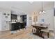 Bright living space showcasing an open floor plan with views of the kitchen, dining, and adjacent rooms at 209 Roman Ct, Deltona, FL 32738