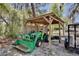 Image of a shed, sheltering a tractor in the backyard at 209 Roman Ct, Deltona, FL 32738