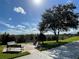 A park area with benches to sit at at 2296 Sirena Ln, Mount Dora, FL 32757