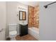 Cozy bathroom with tiled shower, and modern vanity with black storage and fixtures at 2318 Vincent Rd, Orlando, FL 32817