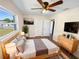 Cozy bedroom with a ceiling fan, natural light, and stylish decor at 2318 Vincent Rd, Orlando, FL 32817