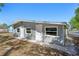 Exterior view of the home with modern siding, multiple entrances and windows at 2318 Vincent Rd, Orlando, FL 32817
