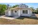 Well-maintained home showcasing a manicured lawn and tidy landscaping that enhances its curb appeal at 2318 Vincent Rd, Orlando, FL 32817
