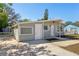 Charming single-story home with a well-maintained front yard, featuring a concrete driveway and lovely neutral gray exterior at 2318 Vincent Rd, Orlando, FL 32817