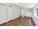Spacious living room featuring hardwood floors, a closet, and natural light at 2318 Vincent Rd, Orlando, FL 32817