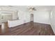 Bright living room featuring wood-look floors and an open floor plan connected to the kitchen at 2318 Vincent Rd, Orlando, FL 32817