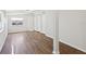 Bright living room featuring hardwood floors, a closet, and natural light at 2318 Vincent Rd, Orlando, FL 32817