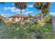 Expansive backyard featuring a pool, patio, and lush green lawn, perfect for outdoor living at 2361 Baker Ave, Orlando, FL 32833