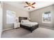Comfortable bedroom with neutral walls, carpet, and large windows at 2361 Baker Ave, Orlando, FL 32833