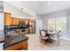 Eat-in kitchen with stainless steel appliances, tile flooring, and ample natural light at 2361 Baker Ave, Orlando, FL 32833