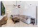 Cozy living room with a comfortable sectional sofa and a ceiling fan at 2361 Baker Ave, Orlando, FL 32833