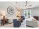 Bright living room with neutral tones, tile floors, and view of the pool at 2361 Baker Ave, Orlando, FL 32833