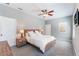 Comfortable main bedroom features neutral walls, ceiling fan, and soft natural light from a window at 2361 Baker Ave, Orlando, FL 32833