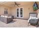 Outdoor patio with comfortable seating, ceiling fan, and a mounted television, perfect for entertaining at 2361 Baker Ave, Orlando, FL 32833
