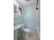 Bright bathroom featuring pedestal sink, toilet, and white tile shower/tub combo at 241 S Marydell Ave, Deland, FL 32720