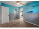 Bedroom with accent wall and a view into an additional room and closet at 241 S Marydell Ave, Deland, FL 32720