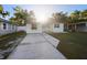 Classic single-story home with a spacious driveway and landscaped front yard at 241 S Marydell Ave, Deland, FL 32720