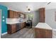 Updated kitchen with stainless steel appliances, stone countertops, and wood cabinets at 241 S Marydell Ave, Deland, FL 32720