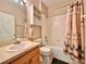 Cozy bathroom with a single sink vanity and a shower and tub combo at 2519 Cypress Trace Cir, Orlando, FL 32825