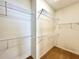 Walk-in closet with installed wire shelving and neutral colored carpet at 2519 Cypress Trace Cir, Orlando, FL 32825
