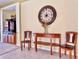 Comfortable living area features neutral tones and a stylish wood console table, complemented by elegant decor at 2519 Cypress Trace Cir, Orlando, FL 32825